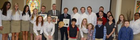 Students from all levels of Haleyville City Schools present special gifts to the state visiting team of State Superintendent Dr. Eric Mackey, Dr. Jeff Langham, chief of staff for the state department of education, and Ryan Hollingsworth, executive director of school superintendents of Alabama.