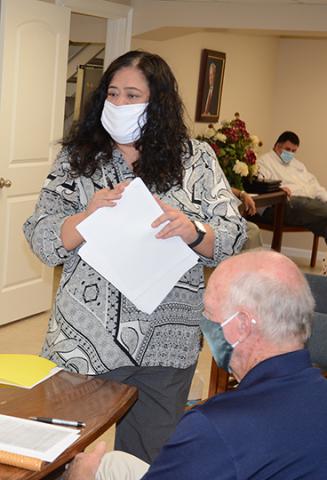 Concerned parent Bobbeth Champion brings hand-outs to Winston County School Board members regarding allegations against Central Office personnel.