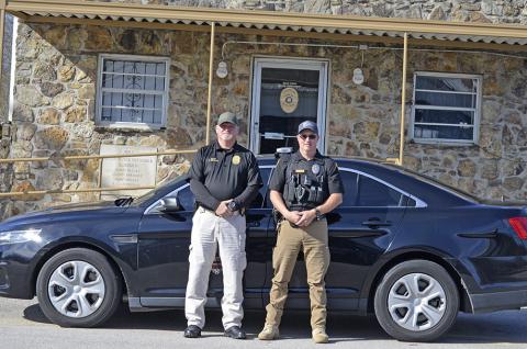 Bear Creek Police Chief Eddie Collins, left, and newly hired police officer Chris Franks, with one of the new patrol cars in the police fleet.  The town will begin accepting applications for officer hired under the COPS grant.