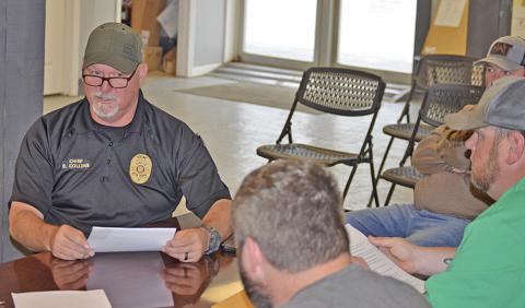 Bear Creek Police Chief Eddie Collins tells the town council that additional measures of safety are needed. Shown are council members Eric Loden, left, and Eric Mills. 