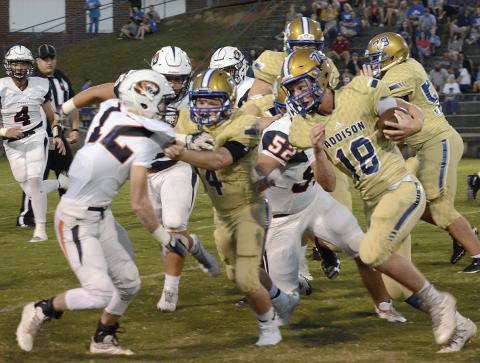 Grant Rice goes around the end for the Addison Bulldogs.