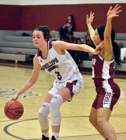 Ally McCollum, the leading scorer for the PHS Lady Bears with 20 points, comes around a Lady Tiger defender.
