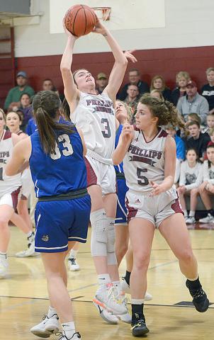 Ally McCollum shoots among a crowd in action against Belgreen in the Area Finals. The She Bears defeated Belgreen 51 to 47.