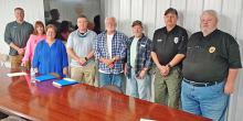 Shown after the appointment of Mitchell Woodard as part-time Addison Police chief, from left, Town Council member Scott Flynn, Clerk Cindy Luker, Mayor Marsha Pigg, council members Jordan Lee, Randy Powell, George Palmer,  Assistant Police Chief Greg Rooks, and Woodard.