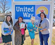 From left, Katie Brown, chairperson of Women United, which helps raise funds for United Way; Johnna Bailey, member of the Arley Women’s Club; Stephanie Childers, executive director of United Way of Cullman County, with the picture of Dolly Parton whose imagination library has kicked off across Winston County.