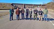 At the site of the project, from left, Natural Bridge Mayor Pete Parrish, Winston County Commission Chairman David Cummings,  Road Engineer James Glasgow, David A. Kemp, Fayette Area Operations Engineer for ALDOT, Lynn Town Clerk Marcia Manasco, Lynn Police Chief Bryan Kirkpatrick, Natural Bridge council members Paul Garrison and Jeremy McCarter.